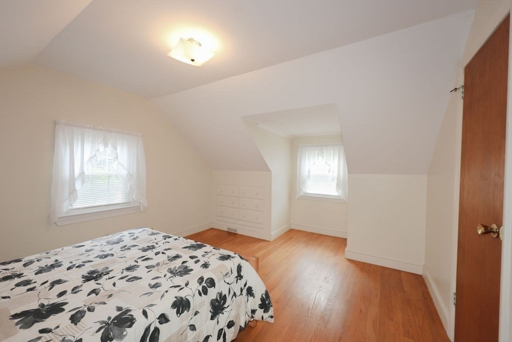35 Walnut Road Chelmsford, MA 01824 - Photo 24 of 42 a bedroom with a bed and wooden floor