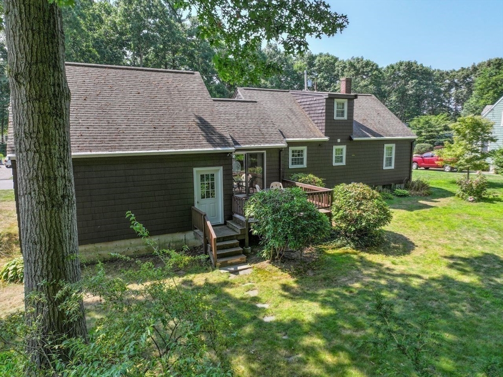 35 Walnut Road Chelmsford, MA 01824 - Photo 33 of 42 a backyard of a house with table and chairs