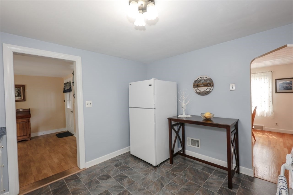 35 Walnut Road Chelmsford, MA 01824 - Photo 7 of 42 a view of kitchen with refrigerator and wooden floor