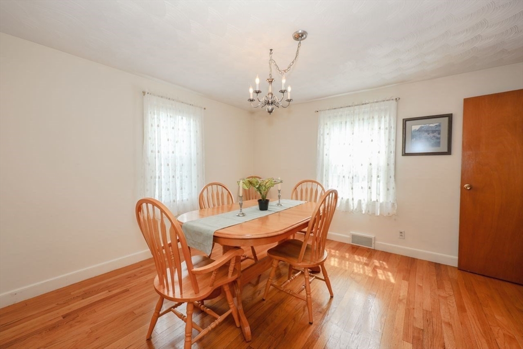 35 Walnut Road Chelmsford, MA 01824 - Photo 9 of 42 a view of a dining room with furniture window and wooden floor