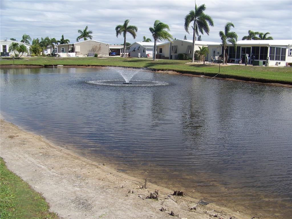 15550 Burnt Store Road, Unit 202 Punta Gorda, FL 33955 - Photo 3 of 61 a view of swimming pool and lake view