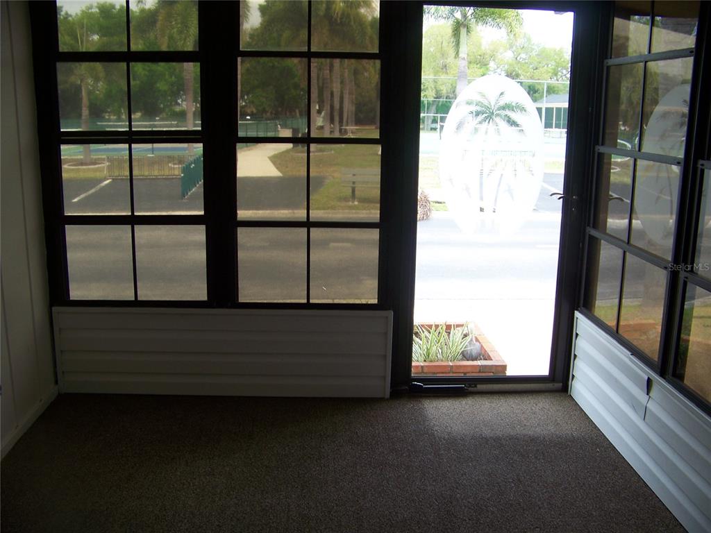 15550 Burnt Store Road, Unit 202 Punta Gorda, FL 33955 - Photo 31 of 61 a view of entry way with wooden floor and windows