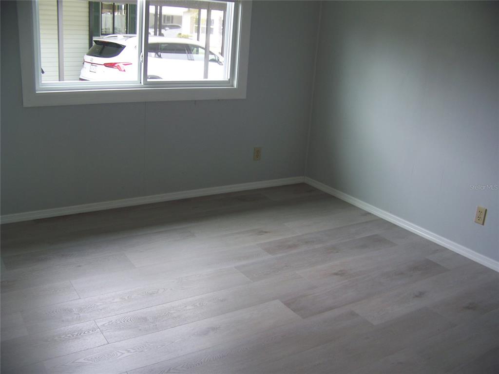 15550 Burnt Store Road, Unit 202 Punta Gorda, FL 33955 - Photo 35 of 61 an empty room with a window