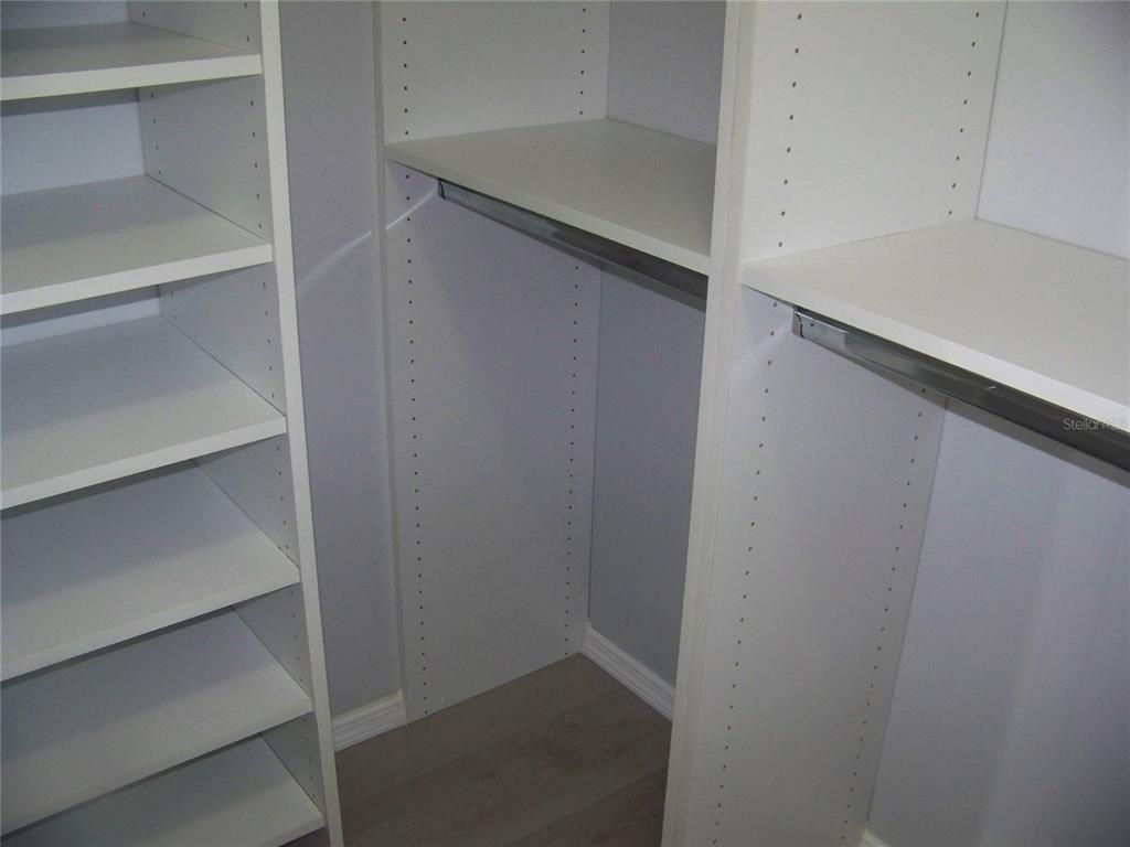 15550 Burnt Store Road, Unit 202 Punta Gorda, FL 33955 - Photo 39 of 61 a view of walk in closet with empty racks