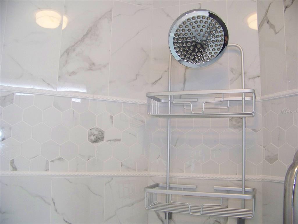 15550 Burnt Store Road, Unit 202 Punta Gorda, FL 33955 - Photo 42 of 61 a bathroom with a shower