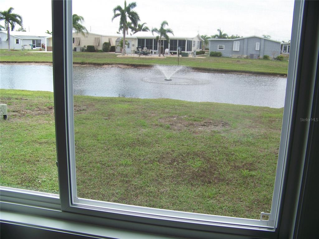 15550 Burnt Store Road, Unit 202 Punta Gorda, FL 33955 - Photo 46 of 61 a view of swimming pool from a window