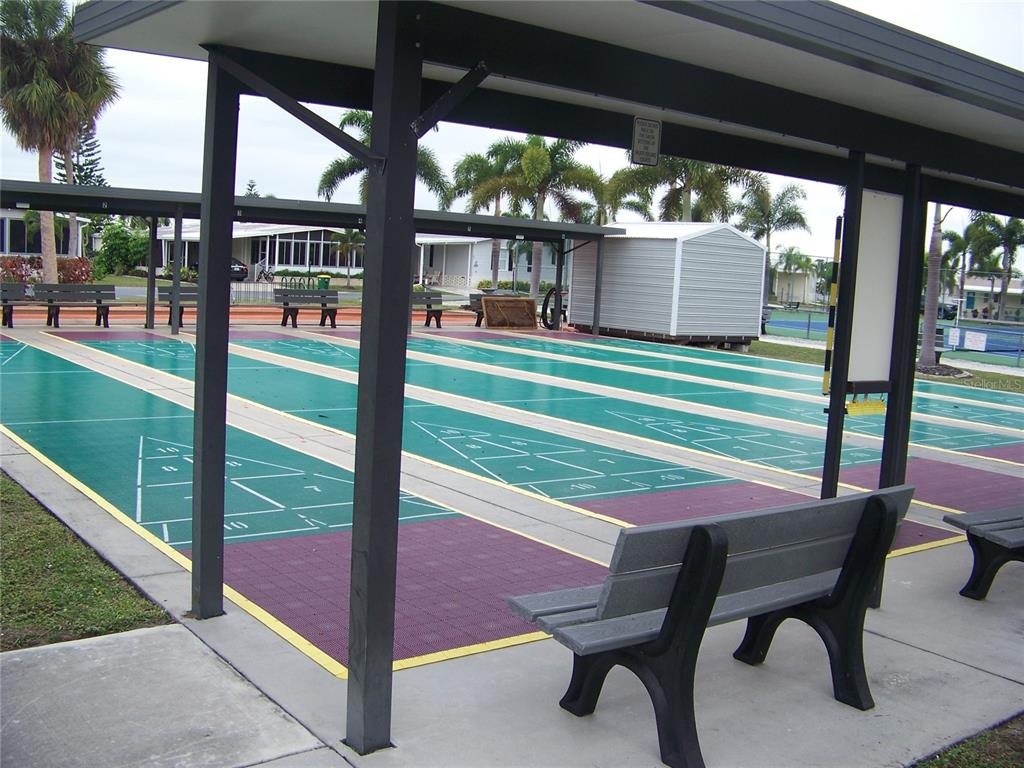 15550 Burnt Store Road, Unit 202 Punta Gorda, FL 33955 - Photo 56 of 61 a patio with table and chairs