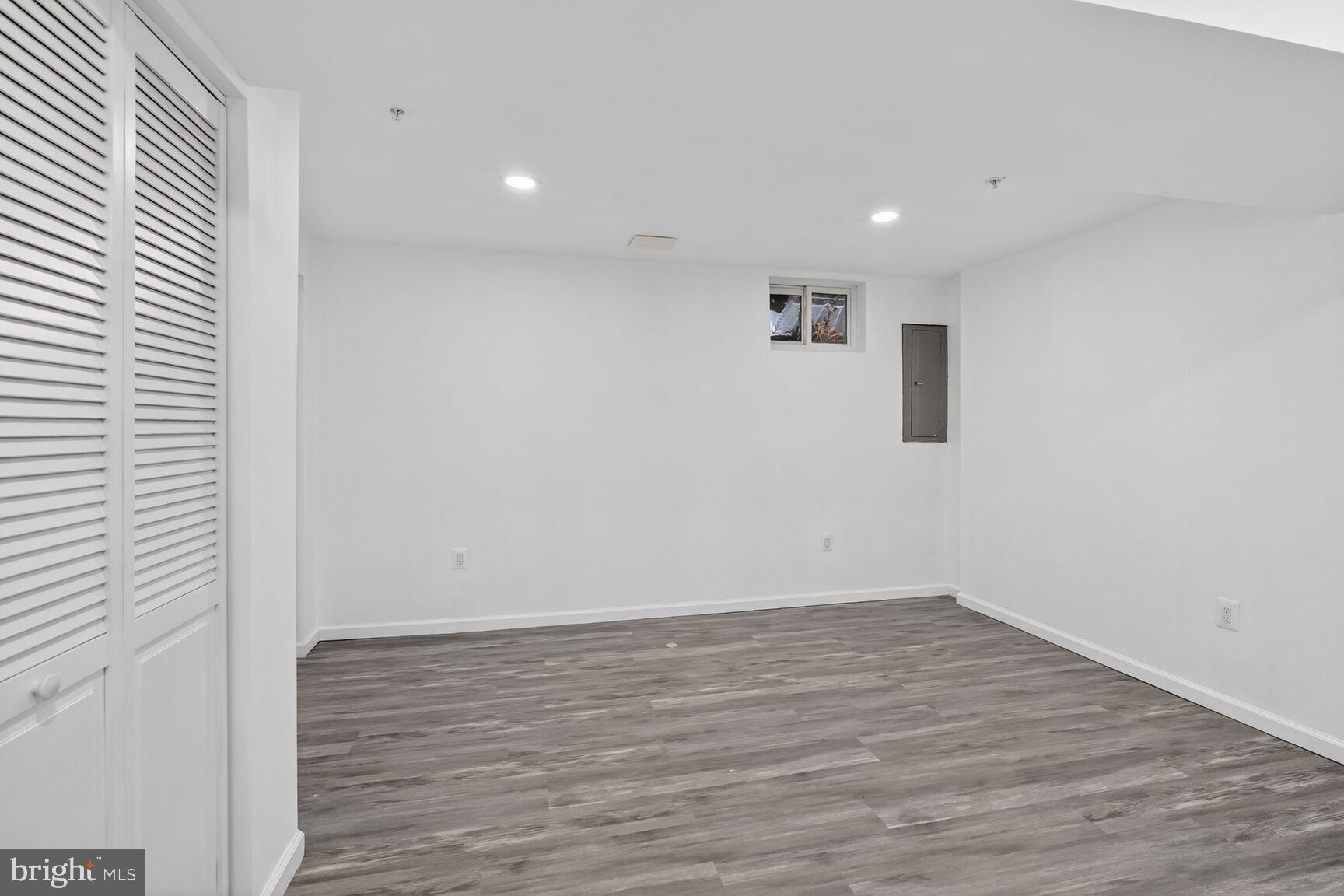20415 Boulder Ridge Terrace Gaithersburg, MD 20882 - Photo 12 of 24 a view of a room with wooden floor and window