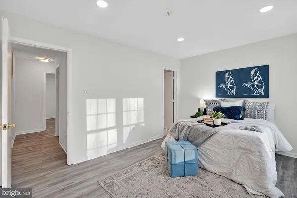 a bedroom with bed and a window