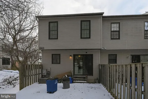 a front view of a house with parking area