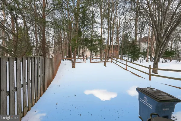 a view of a patio with wooden fence