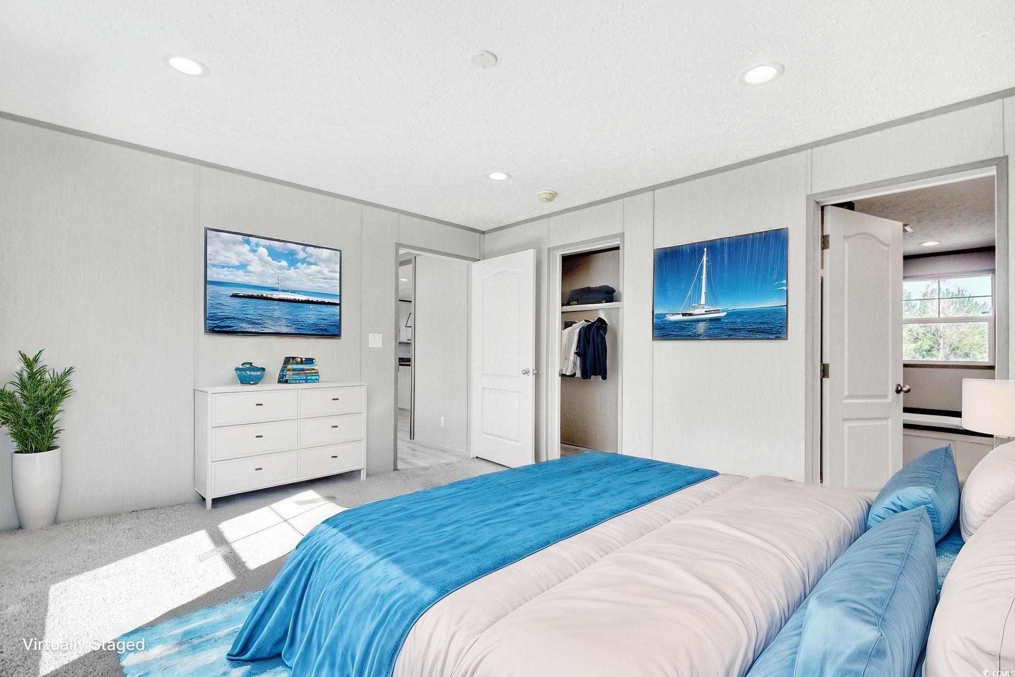 280 Samuel Road Loris, SC 29569 - Photo 13 of 29 Bedroom with a closet, light carpet, and a texture