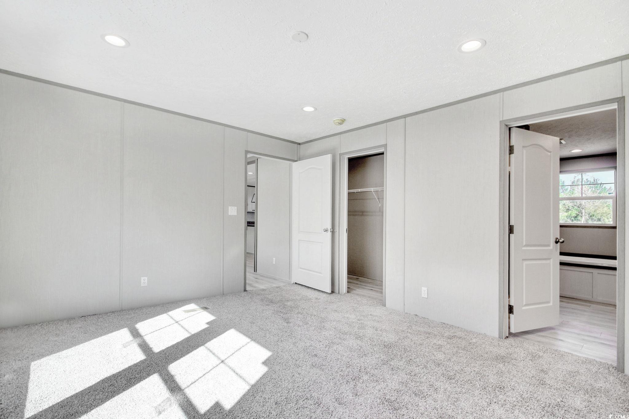 280 Samuel Road Loris, SC 29569 - Photo 17 of 29 Unfurnished bedroom with light carpet and a textur