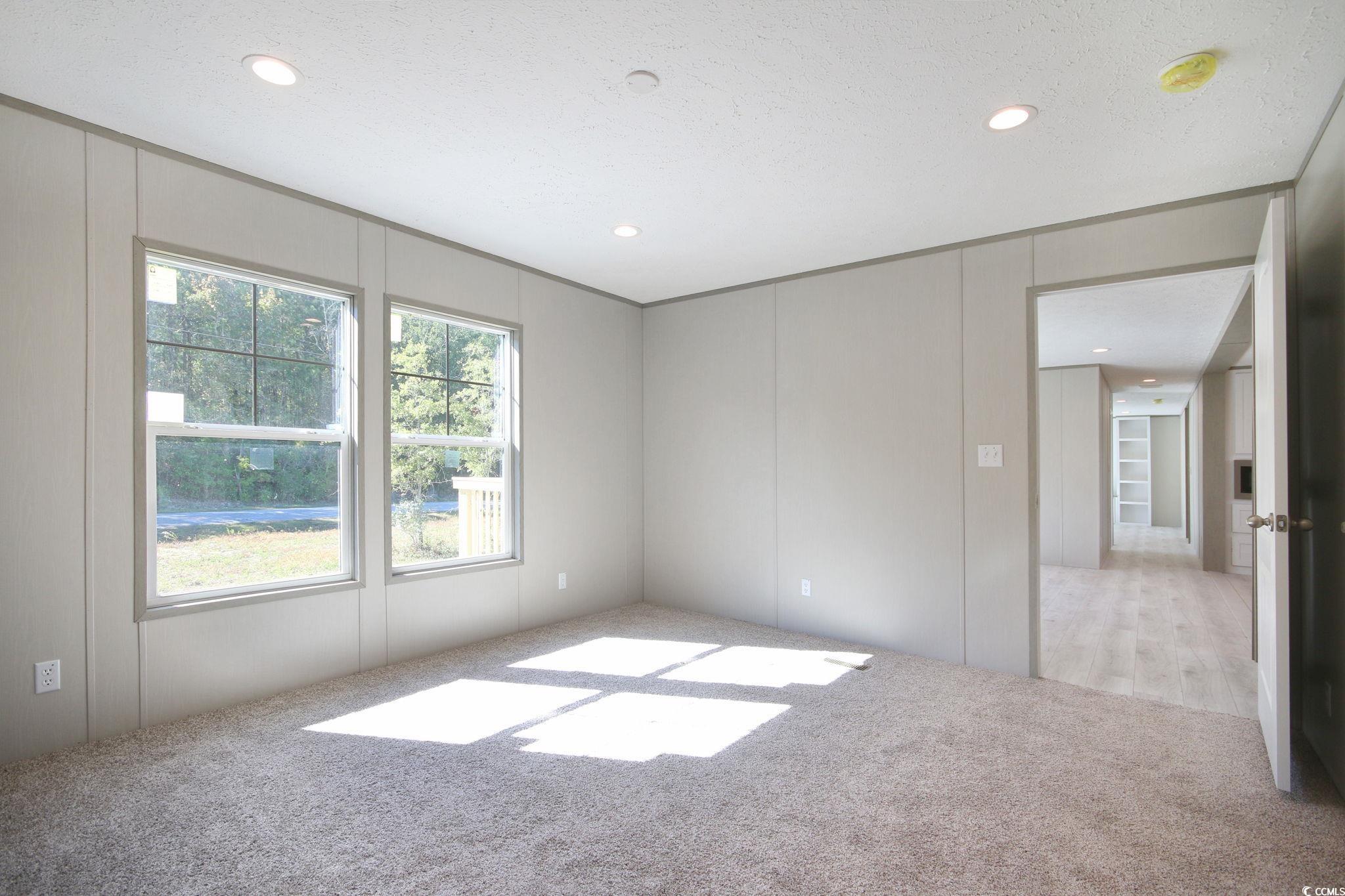 280 Samuel Road Loris, SC 29569 - Photo 18 of 29 Carpeted spare room featuring a textured ceiling