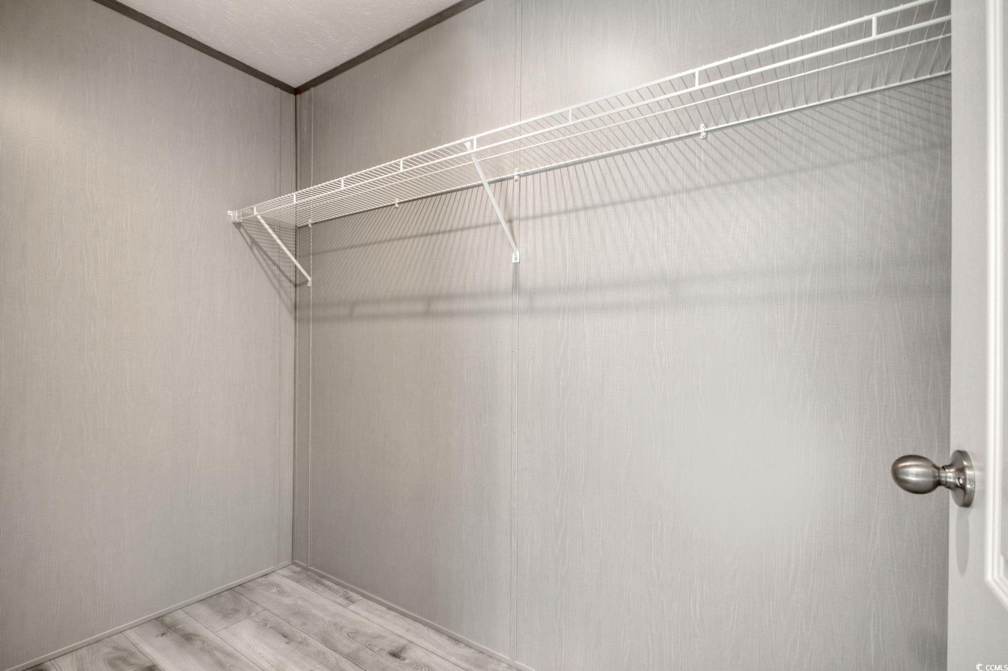 280 Samuel Road Loris, SC 29569 - Photo 19 of 29 Spacious closet featuring light wood-type flooring