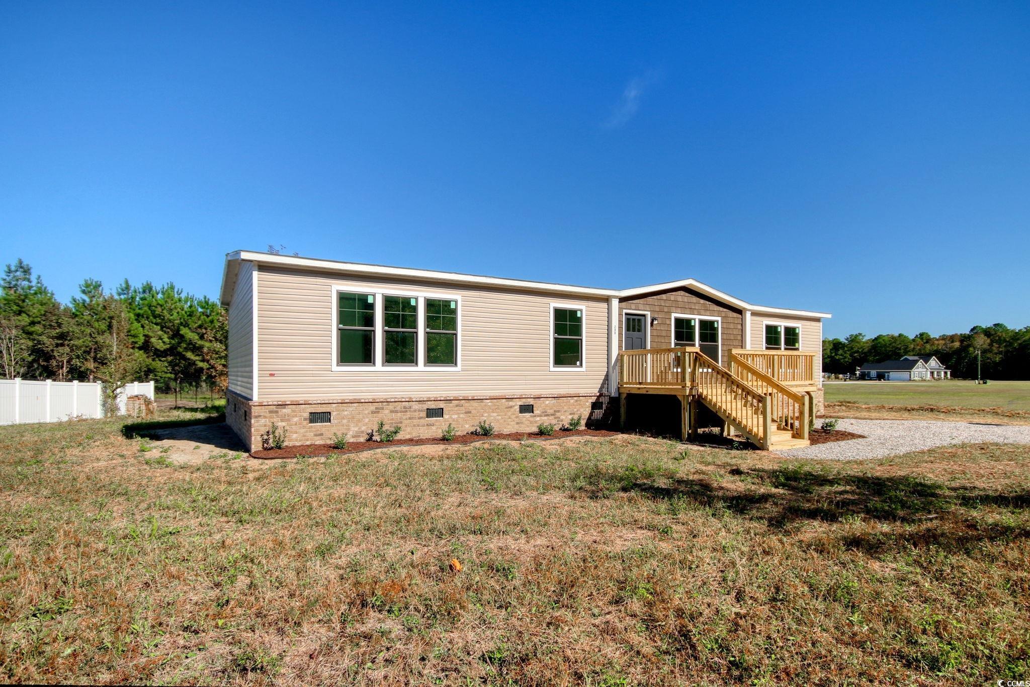 280 Samuel Road Loris, SC 29569 - Photo 2 of 29 Back of house featuring a lawn