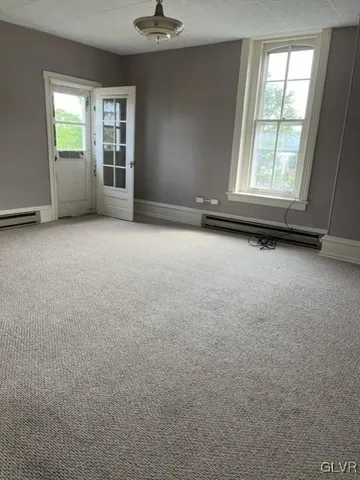an empty room with windows