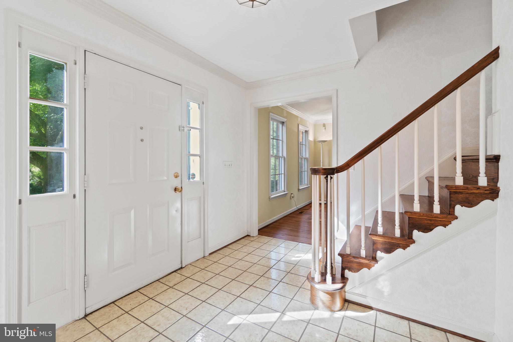 7409 Warfield Road Gaithersburg, MD 20882 - Photo 11 of 22 a view of an entryway with staircase