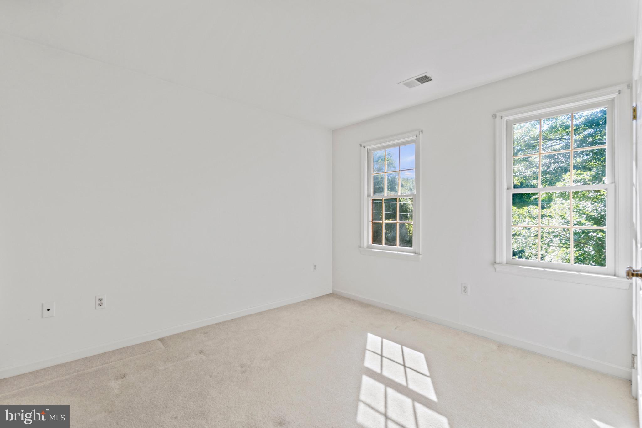 7409 Warfield Road Gaithersburg, MD 20882 - Photo 17 of 22 a view of an empty room with a window