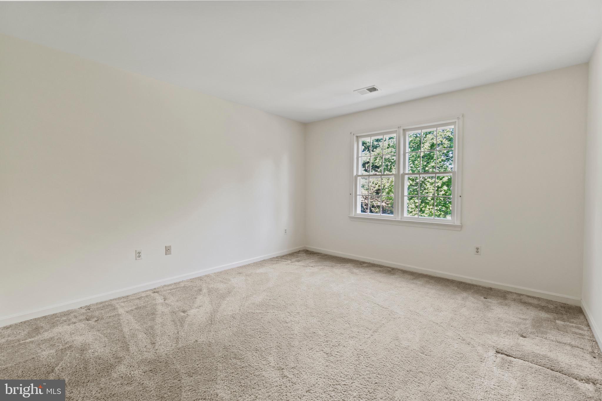 7409 Warfield Road Gaithersburg, MD 20882 - Photo 18 of 22 an empty room with windows