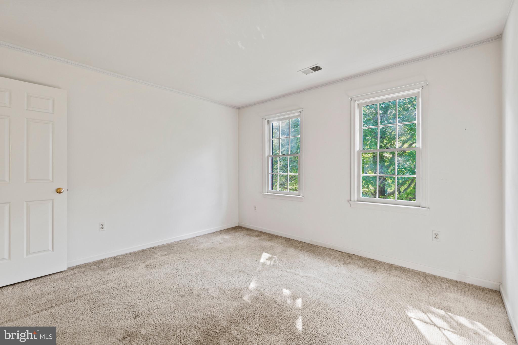 7409 Warfield Road Gaithersburg, MD 20882 - Photo 19 of 22 a view of an empty room with a window