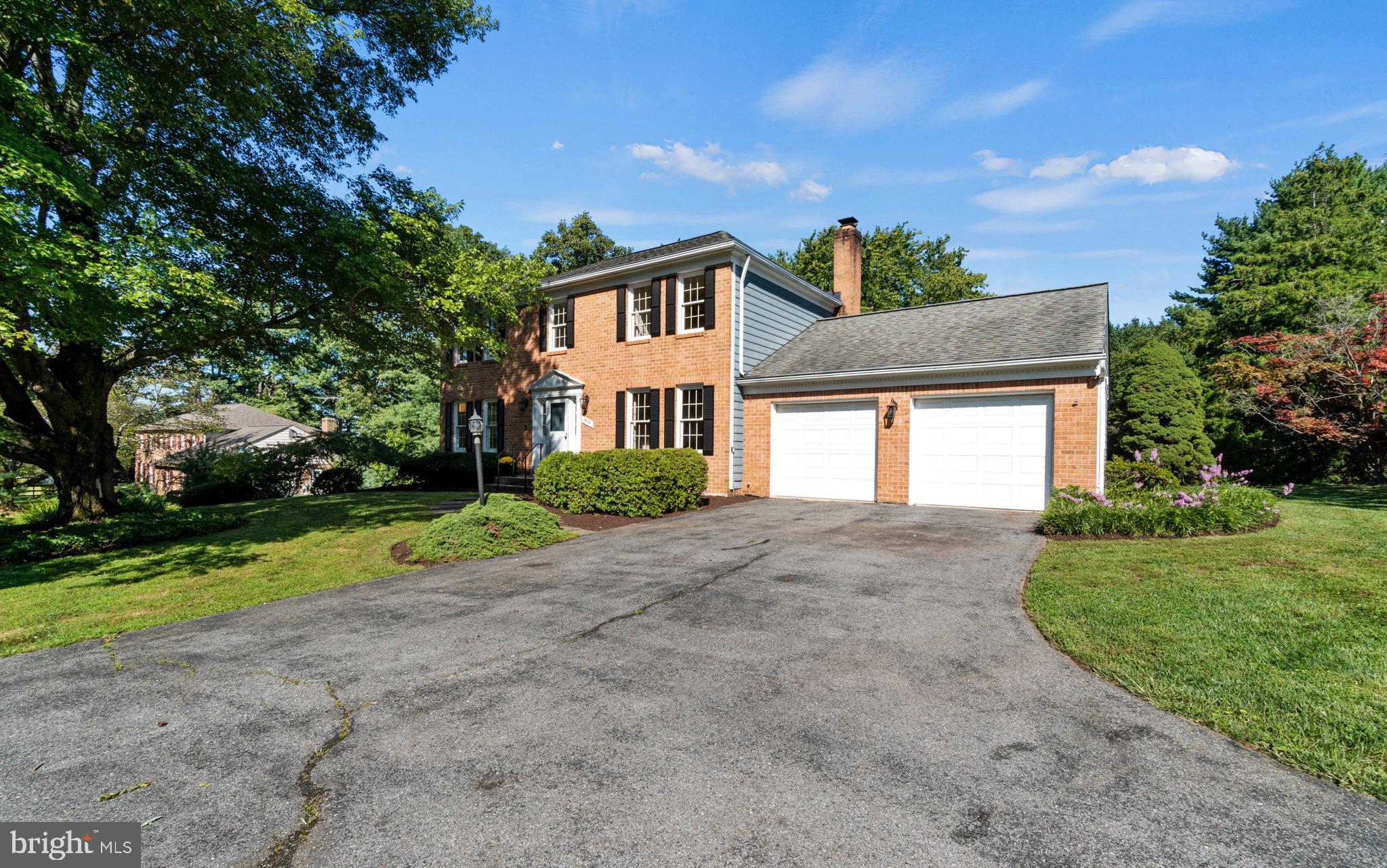 7409 Warfield Road Gaithersburg, MD 20882 - Photo 22 of 22 a front view of a house with a yard and garage