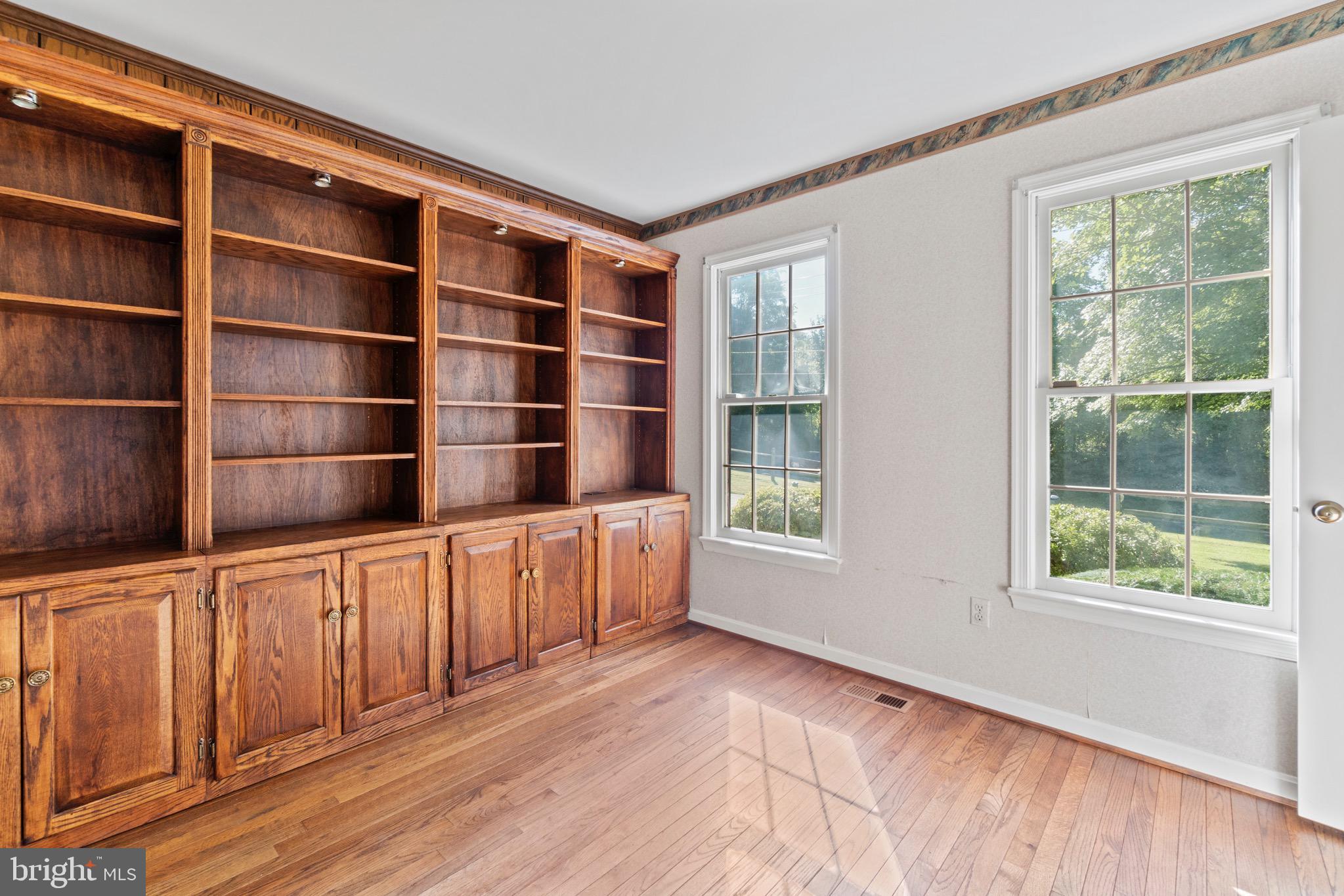 7409 Warfield Road Gaithersburg, MD 20882 - Photo 4 of 22 a view of an empty room with a window