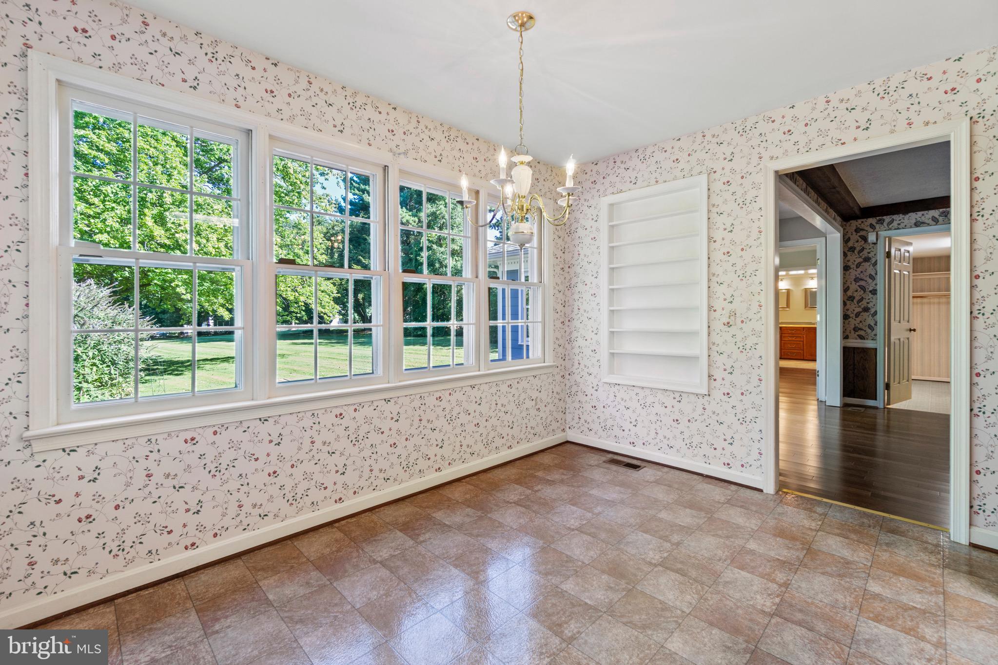 7409 Warfield Road Gaithersburg, MD 20882 - Photo 7 of 22 a view of an empty room with a window
