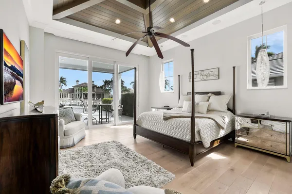 a bedroom with a bed couch and window
