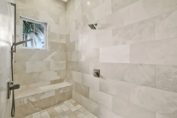 a bathroom with a shower and bathtub