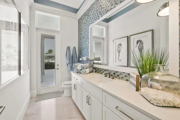 a bathroom with a sink a mirror and a shower
