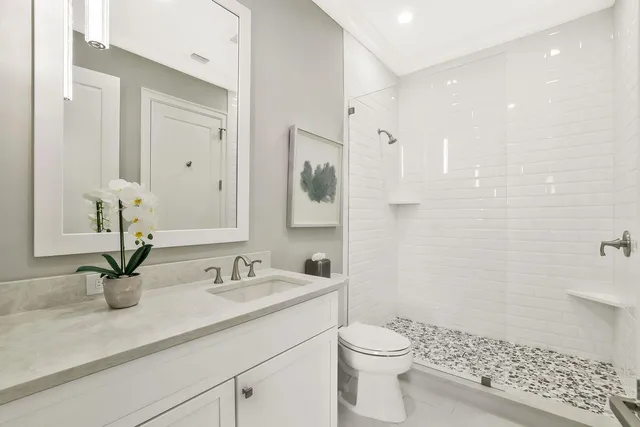 a bedroom with a bed and a chair