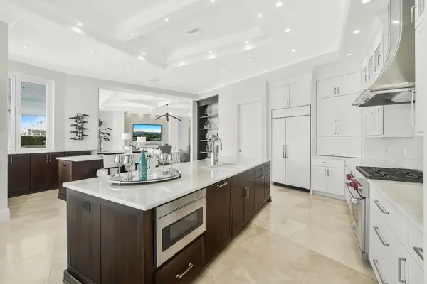 a kitchen with a sink stove and cabinets