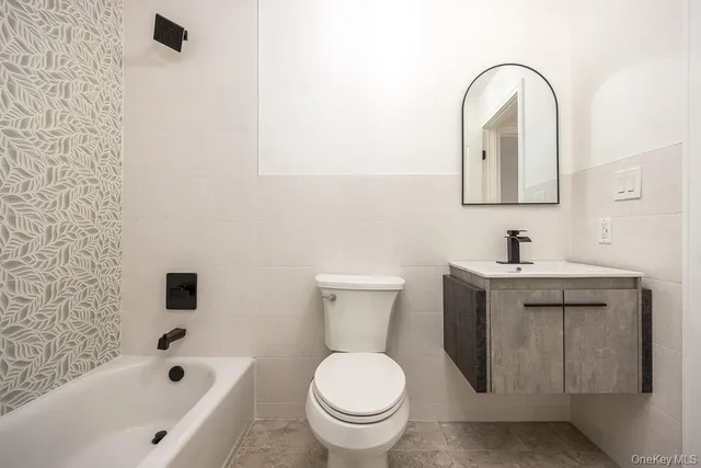 a bathroom with a sink a toilet and a bathtub