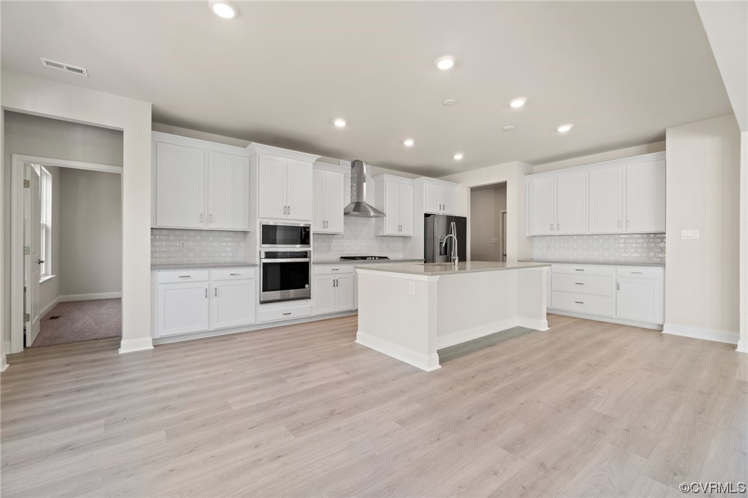 12812 Lonan Avenue Chesterfield, VA 23838 - Photo 15 of 49 a view of kitchen with wooden floor and electronic appliances