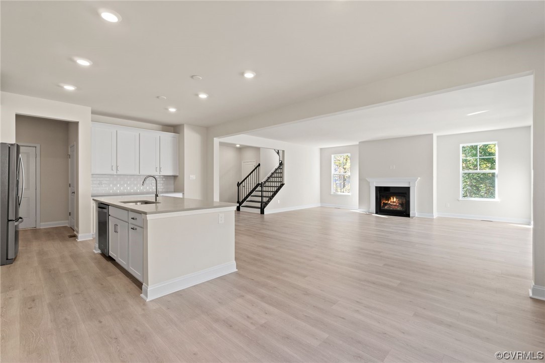 12812 Lonan Avenue Chesterfield, VA 23838 - Photo 22 of 49 a kitchen with a sink and a refrigerator