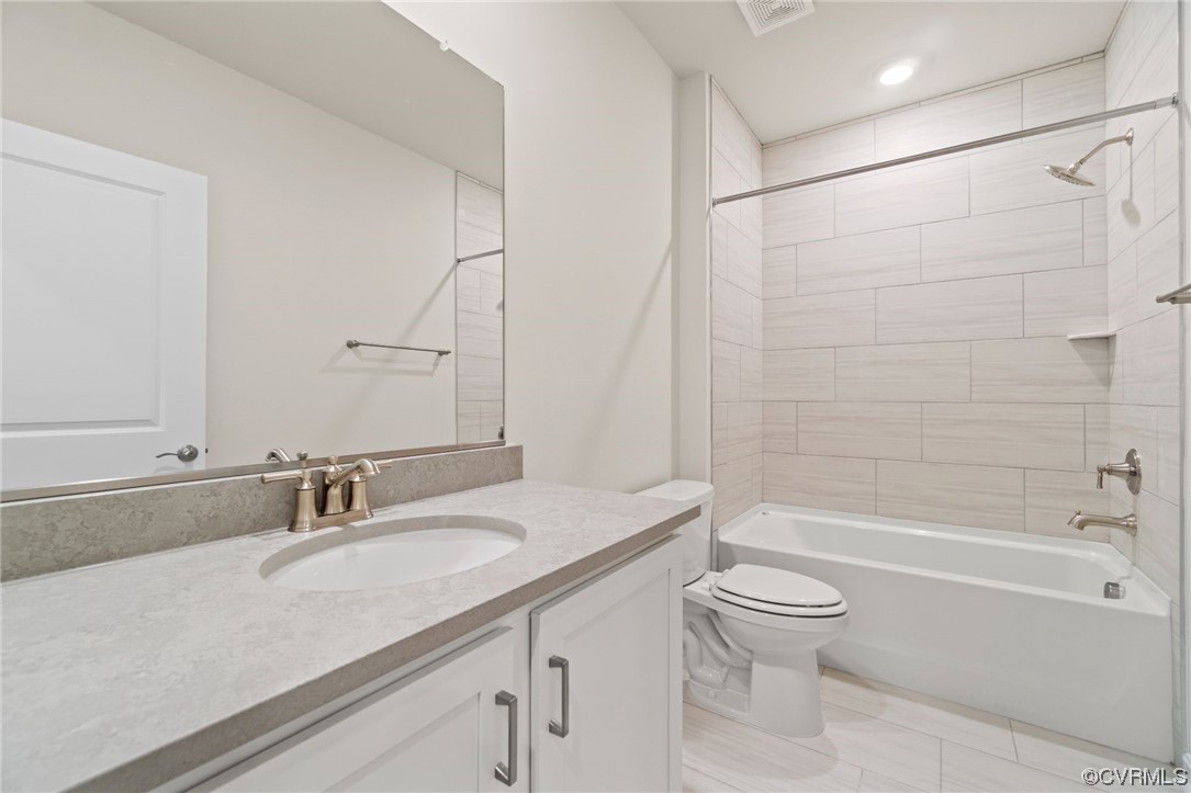 12812 Lonan Avenue Chesterfield, VA 23838 - Photo 3 of 49 a bathroom with a granite countertop sink a toilet and shower
