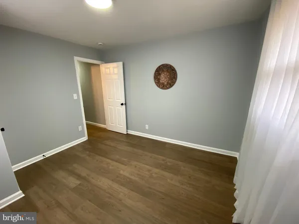 an empty room with a fan