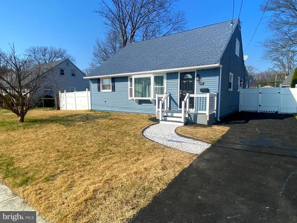 a front view of a house with yard outdoor seating and yard