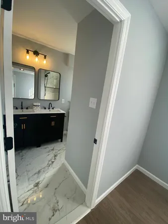 a bathroom with a sink and mirror