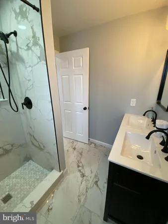 a bathroom with a sink and mirror