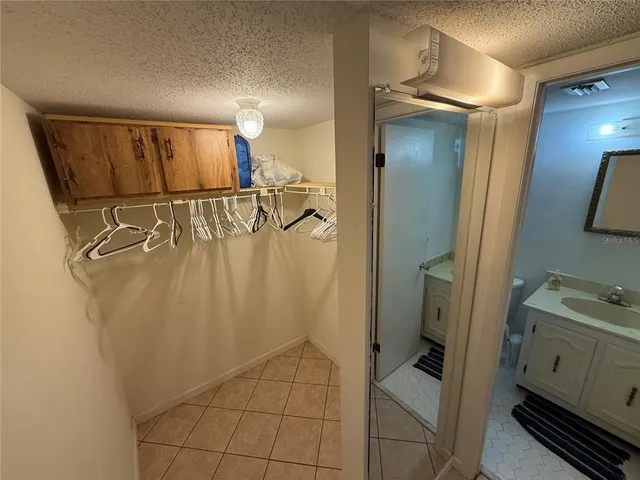 a bathroom with a shower and a sink