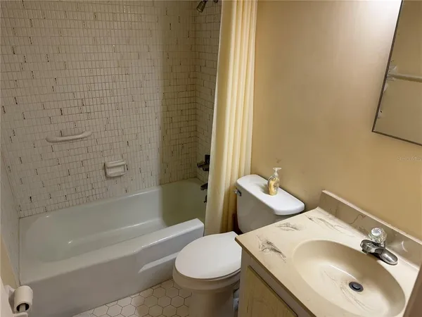 a bathroom with a sink and toilet
