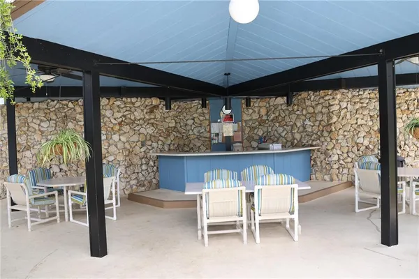 a view of an outdoor dining space with furniture