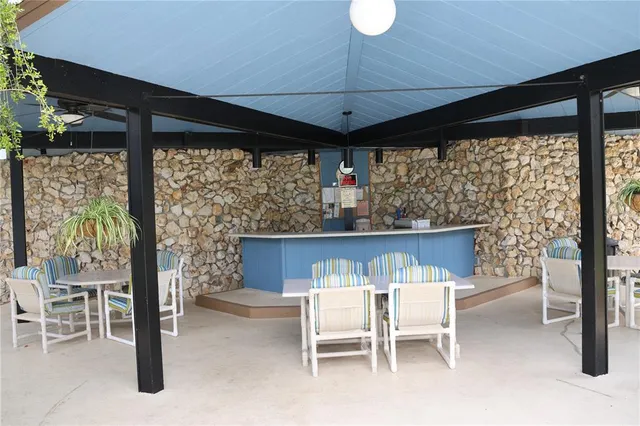 a view of an outdoor dining space with furniture
