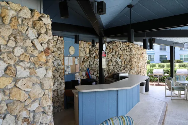 a room with lots of wooden furniture and a fireplace