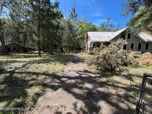 a aerial view of a house with a yard