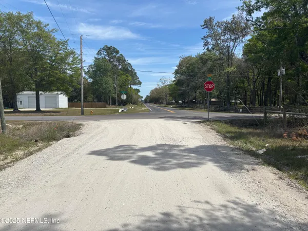 a view of a backyard of the house