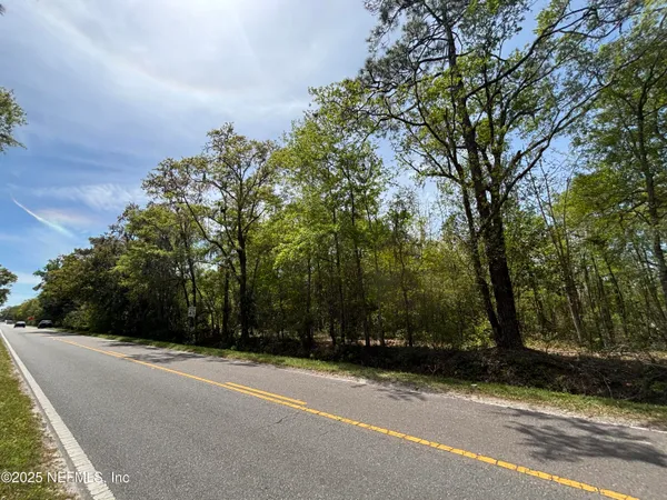a view of a house with a tree