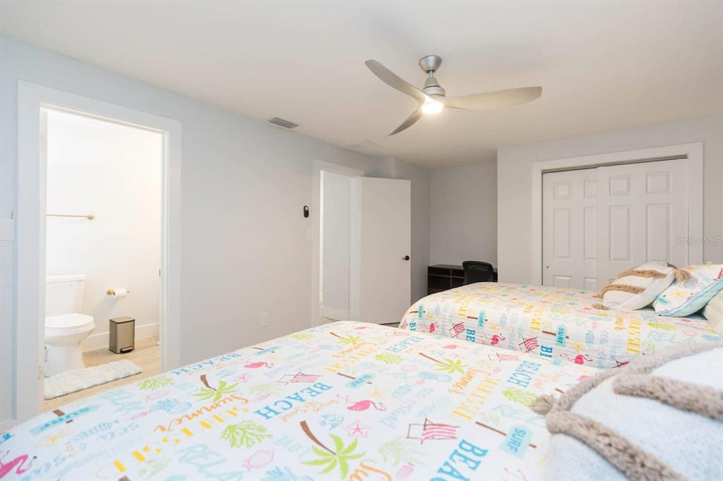 1613 Druid Road Clearwater, FL 33756 - Photo 22 of 47 a bedroom with a bed and a window